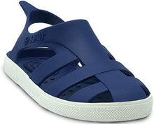 Sandalias Boatilus BIOTY de color beige con tiras de piel y suela plana, ideales para verano y uso casual.